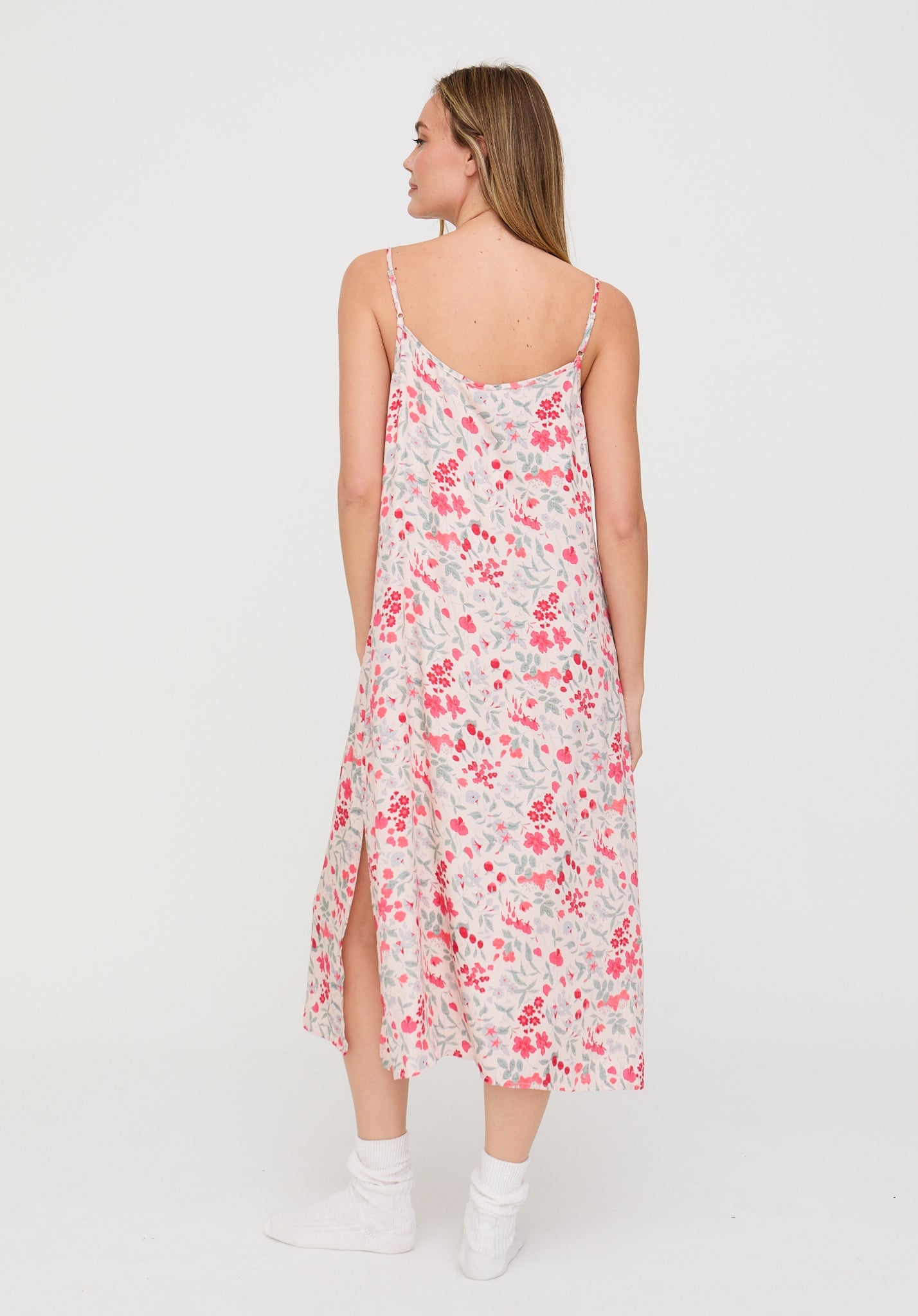 Woman wearing a floral dress on a white background