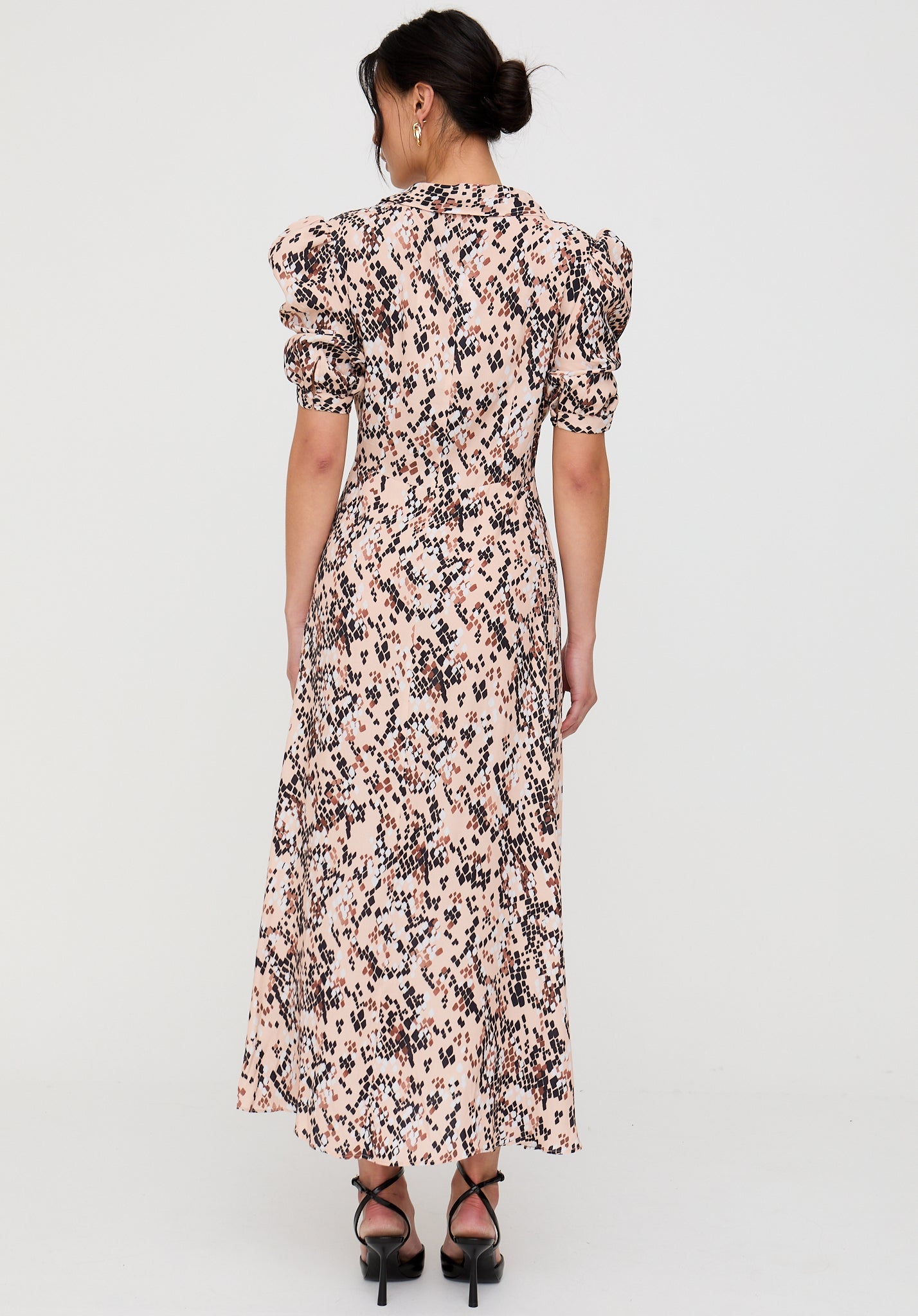 Woman wearing a floral dress on a white background