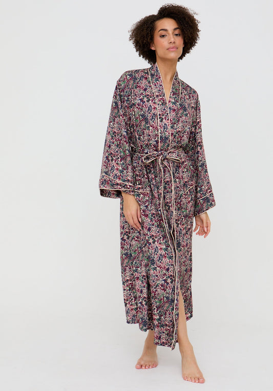 Woman wearing a floral robe on a white background