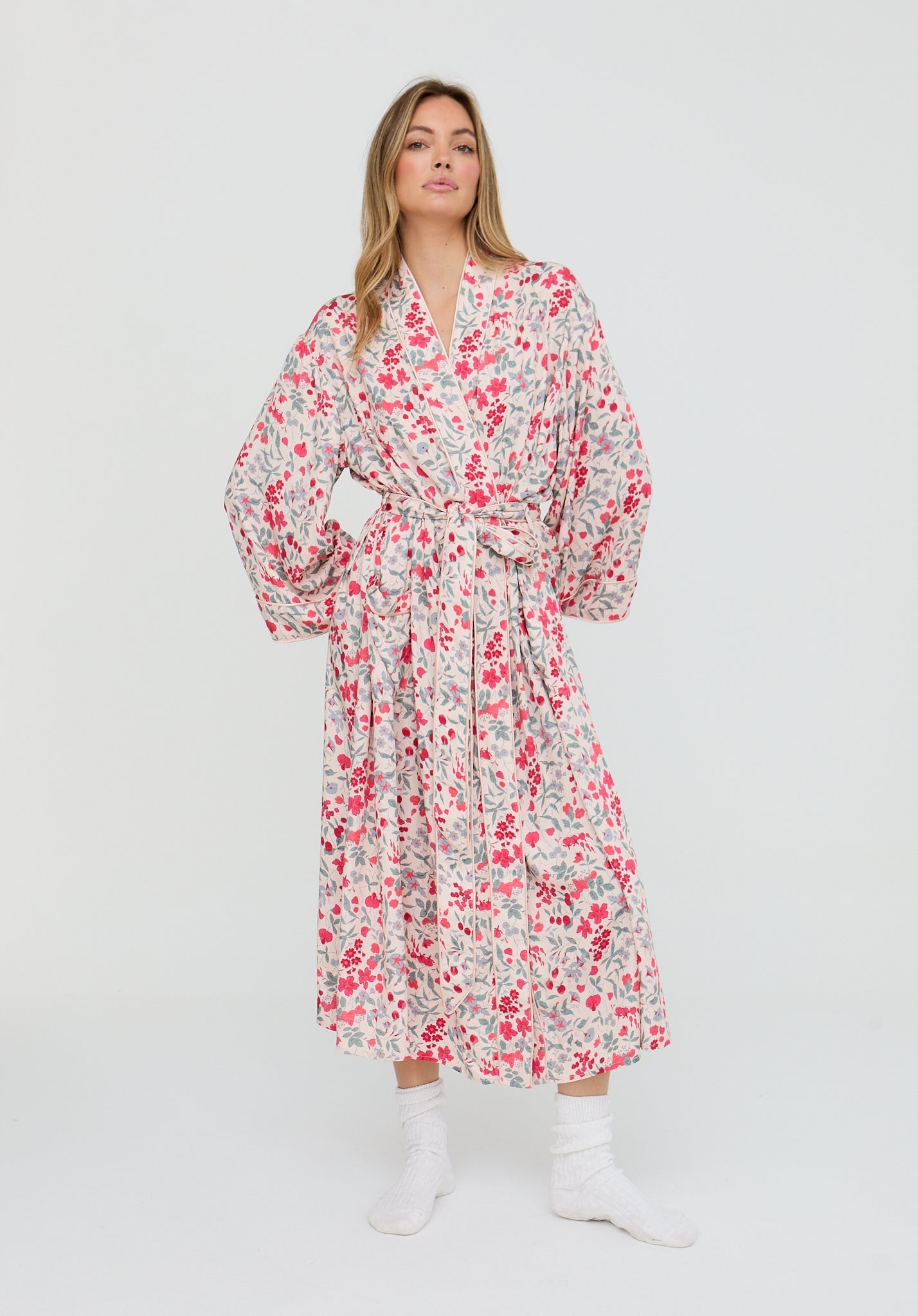 Woman wearing a floral dress on a white background