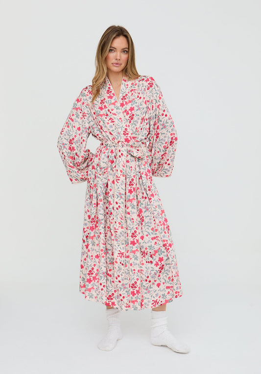 Woman wearing a floral robe on a white background