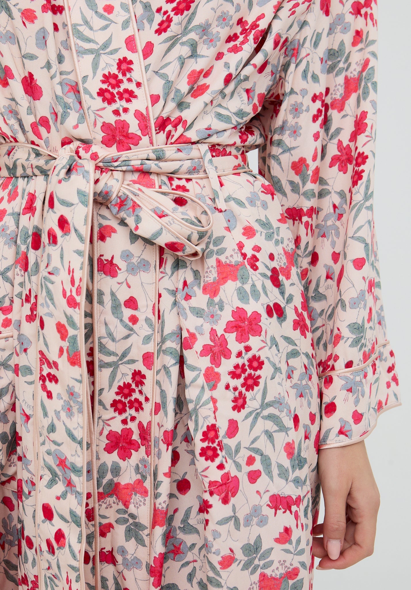 Floral patterned robe with a belt on a neutral background