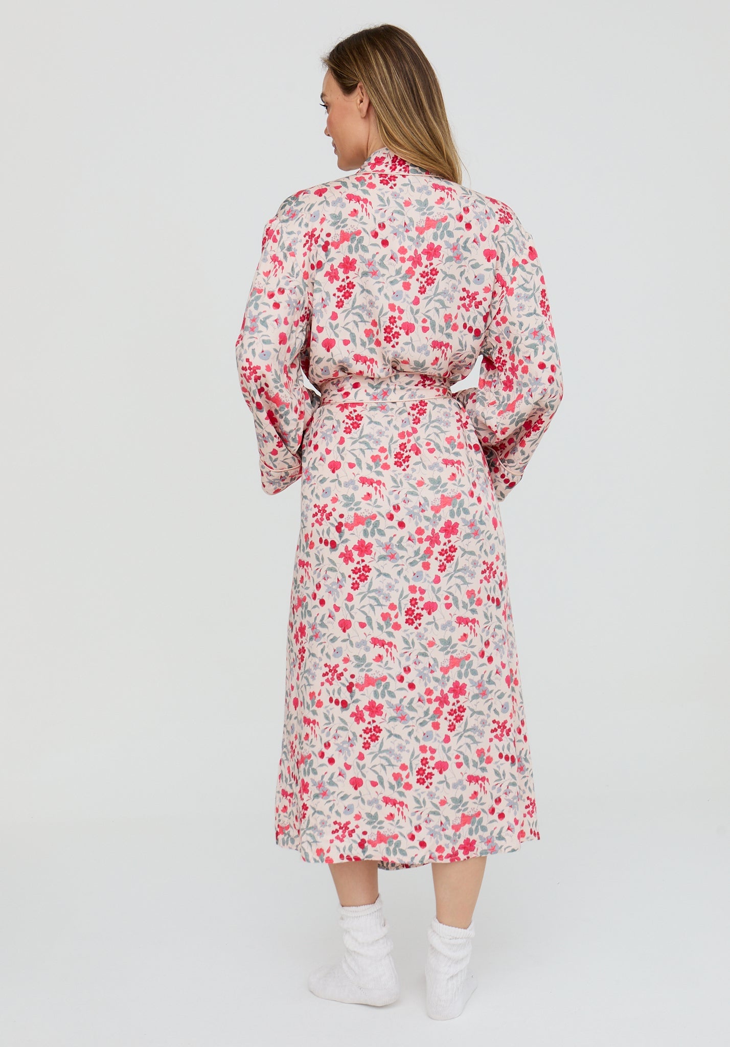 Woman wearing a floral dress on a white background