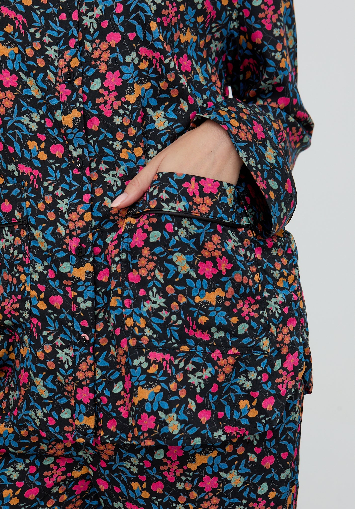 Floral patterned garment with a pocket on a plain background